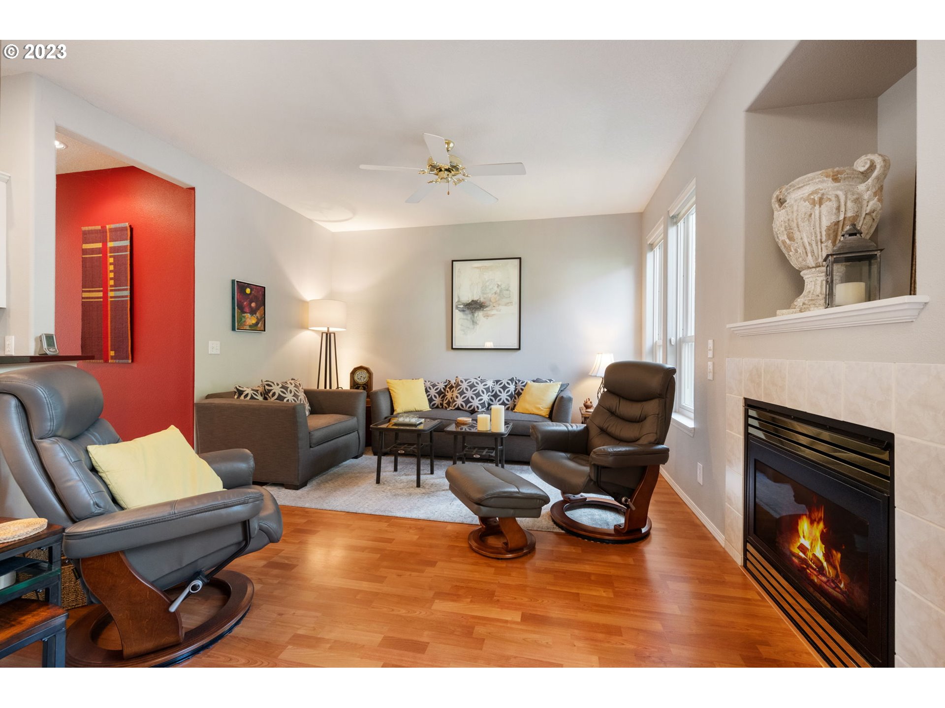 8627 Southwest Lodi Lane Portland, OR 97224 - Photo 8 of 41 a living room with furniture and a fireplace