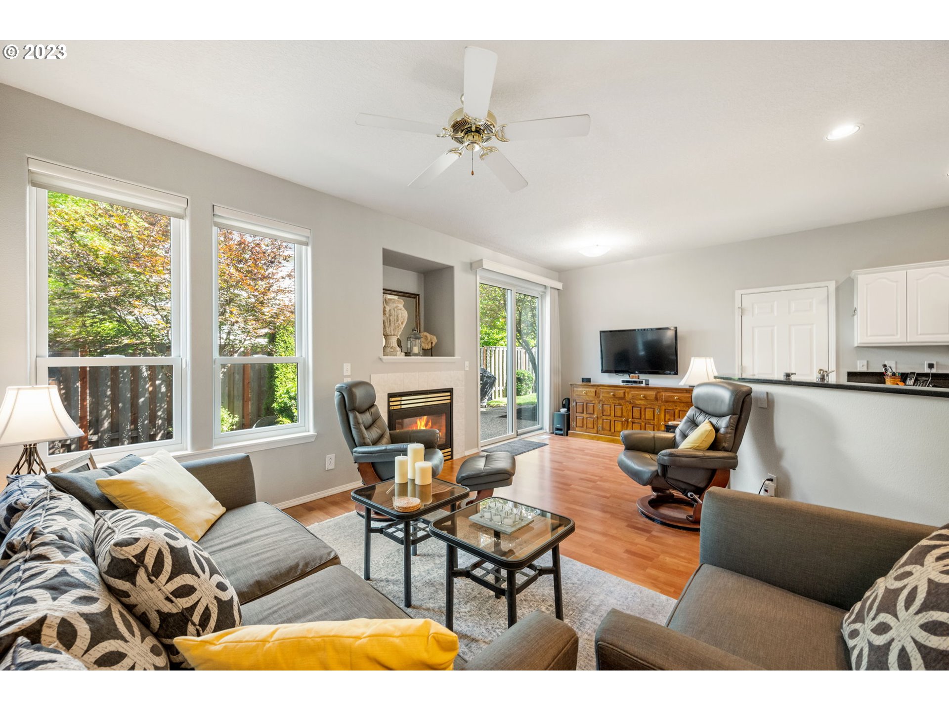 8627 Southwest Lodi Lane Portland, OR 97224 - Photo 9 of 41 a living room with furniture and a flat screen tv