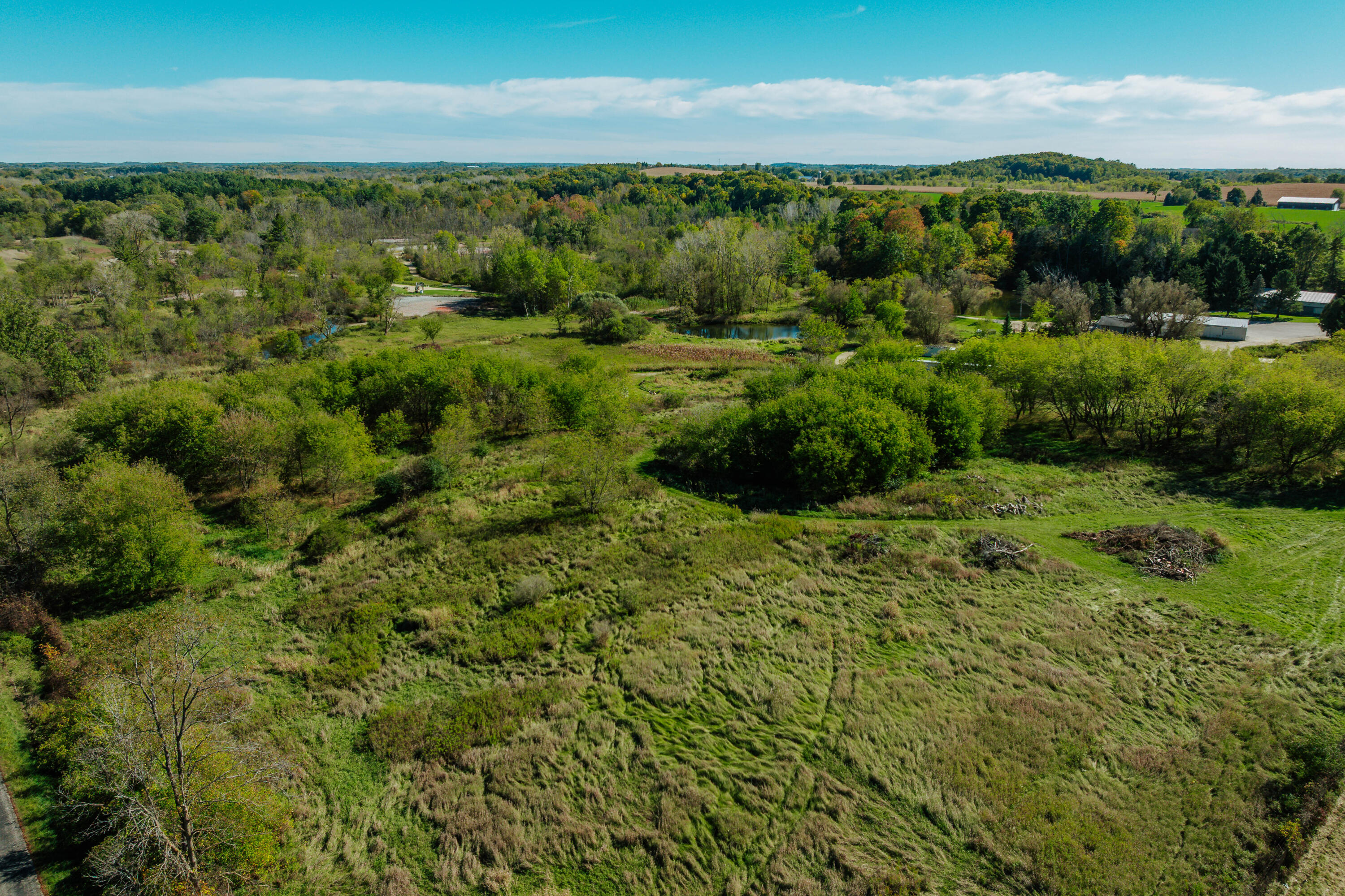 N865 County Road West Ashford, WI 53010 - Photo 36 of 46 With frontage on Spring Drive and Hwy W, develop this unused land for a mini golf course, additional buildings. Limitless possibilities.