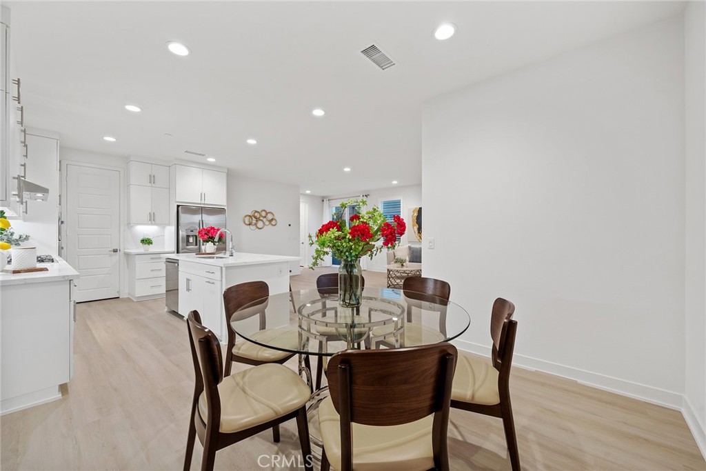 131 Restore Irvine, CA 92618 - Photo 11 of 43 a view of a dining room with furniture and wooden floor