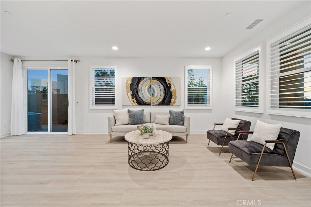 131 Restore Irvine, CA 92618 - Photo 12 of 43 a living room with furniture a window and a table