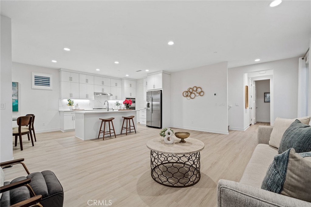 131 Restore Irvine, CA 92618 - Photo 14 of 43 a living room with furniture and kitchen view