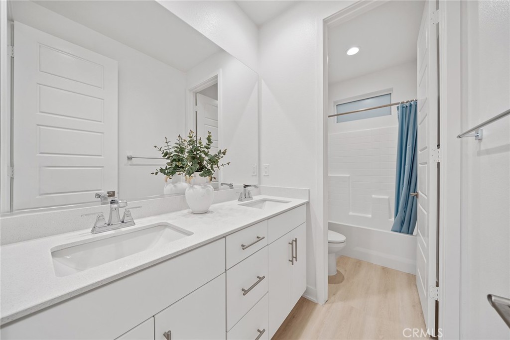 131 Restore Irvine, CA 92618 - Photo 17 of 43 a bathroom with a sink and a mirror