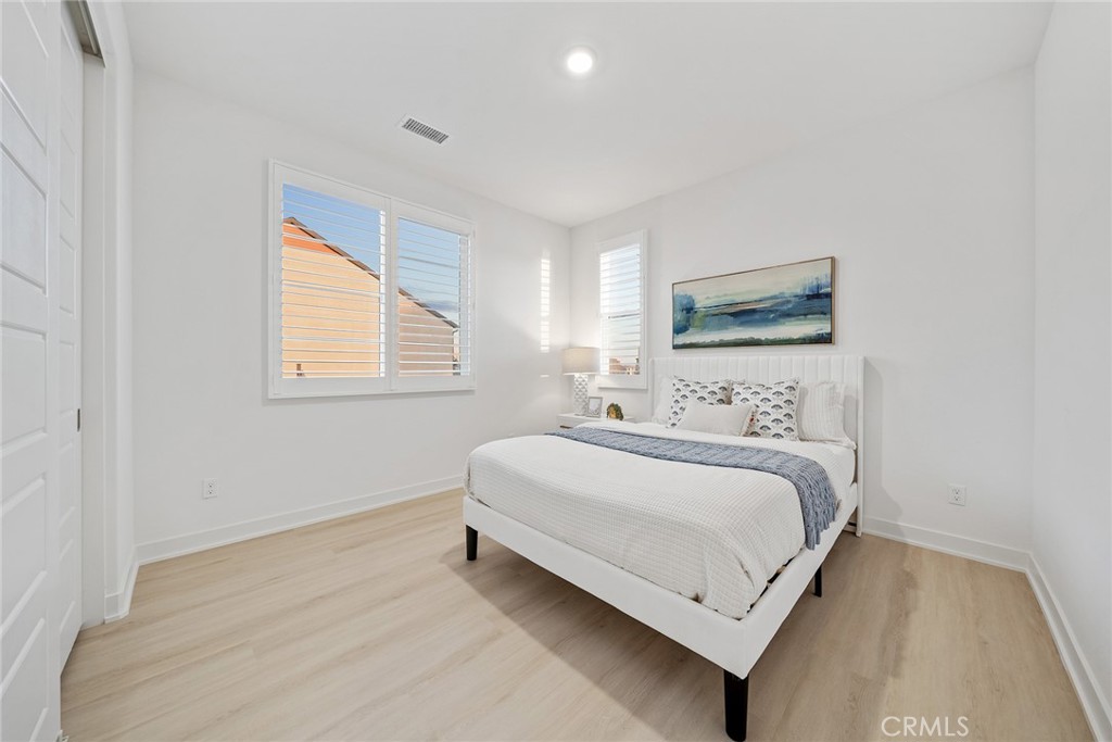 131 Restore Irvine, CA 92618 - Photo 21 of 43 a bedroom with a bed and a window