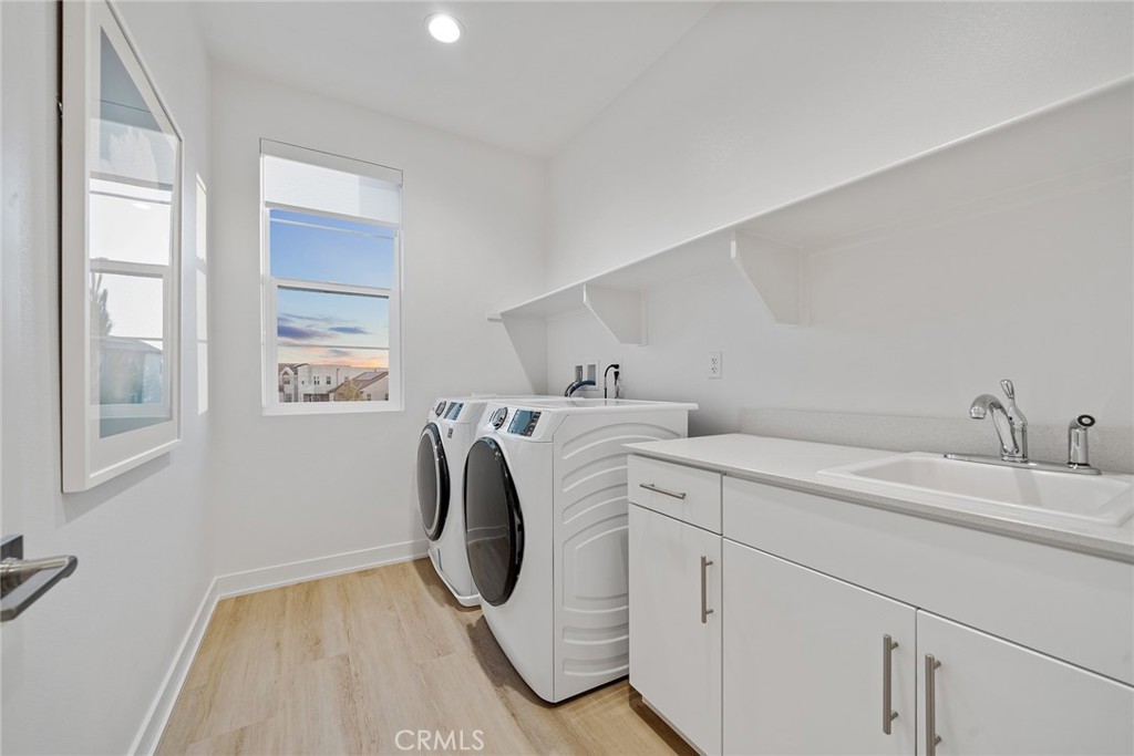 131 Restore Irvine, CA 92618 - Photo 24 of 43 a utility room with dryer and washer