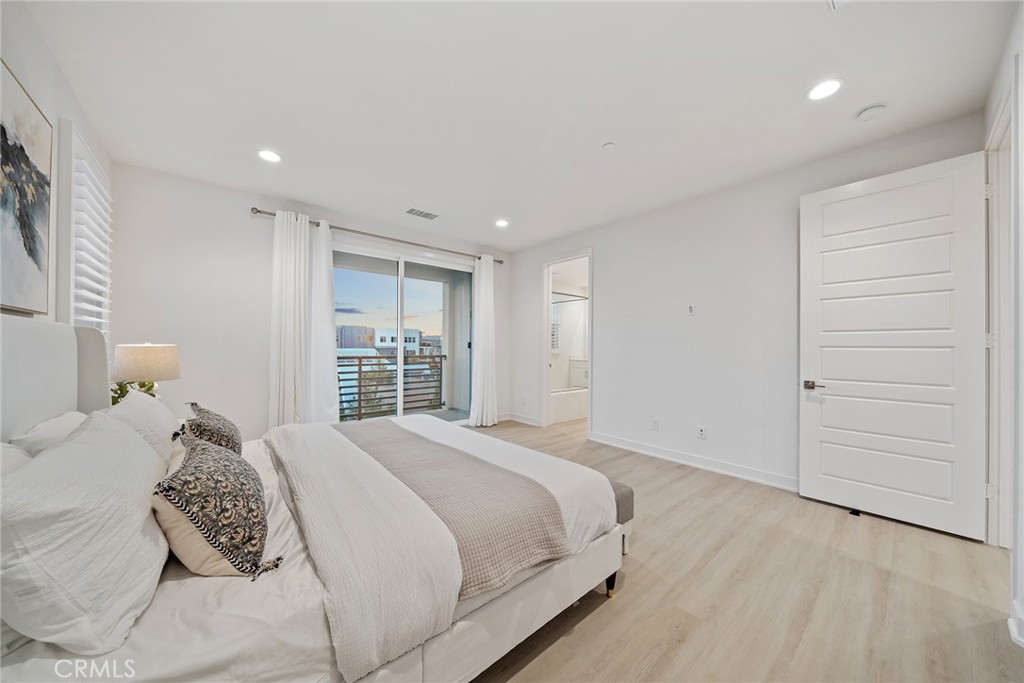 131 Restore Irvine, CA 92618 - Photo 34 of 43 a bedroom with a large bed and a window