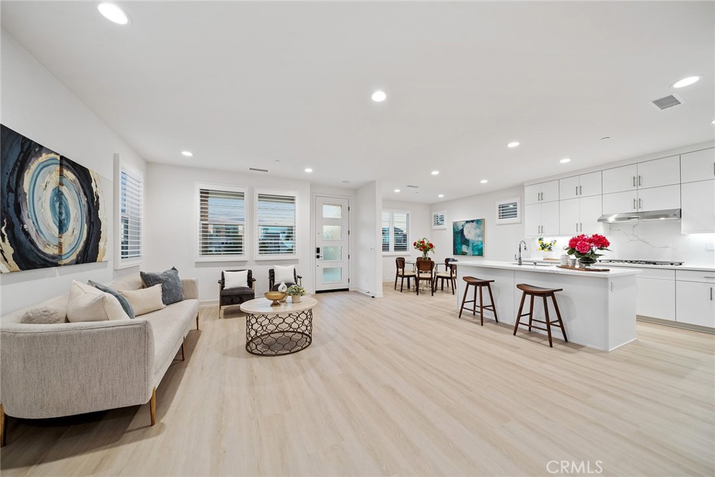 131 Restore Irvine, CA 92618 - Photo 4 of 43 a living room with furniture and wooden floor