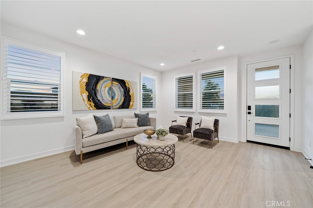 131 Restore Irvine, CA 92618 - Photo 5 of 43 a living room with furniture and wooden floor