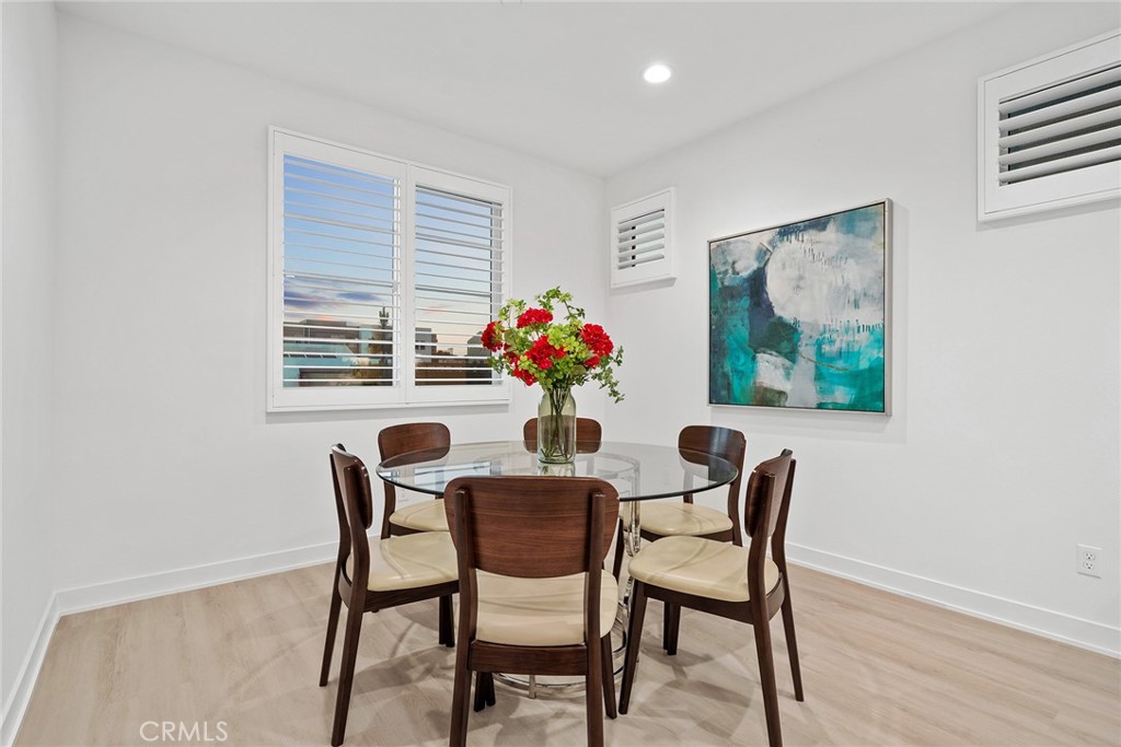 131 Restore Irvine, CA 92618 - Photo 10 of 43 a dining room with furniture and wooden floor