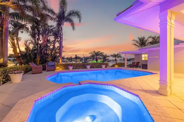 a room with pool table and windows