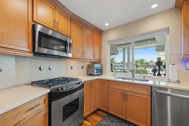 a view of a house with swimming pool and sitting area