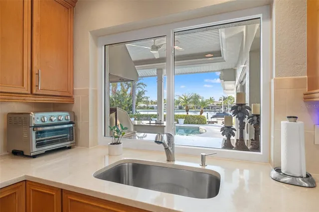 a view of a house with backyard porch and sitting area