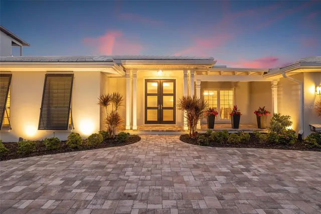 a view of a lake with a beach and a yard