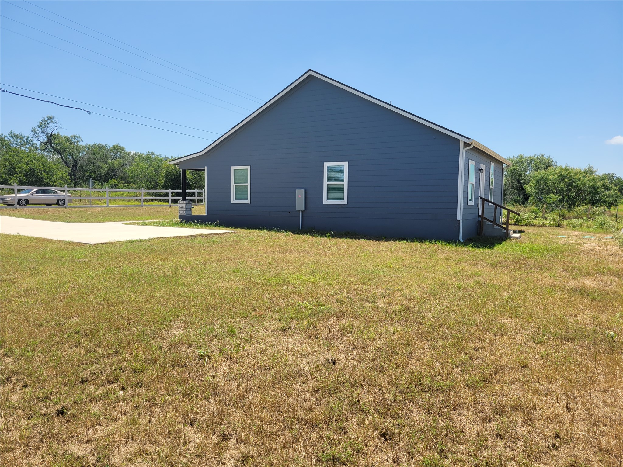 422 A Road Stockdale, TX 78160 - Photo 40 of 40 A well-maintained facade with a neat yard and welcoming front porch.
