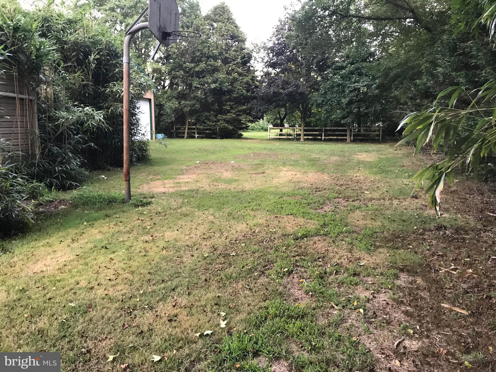 36666 Clubhouse Road Ocean View, DE 19970 - Photo 11 of 18 right of property and home. path to rear area
