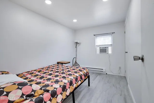 a bathroom with a sink a mirror and shower