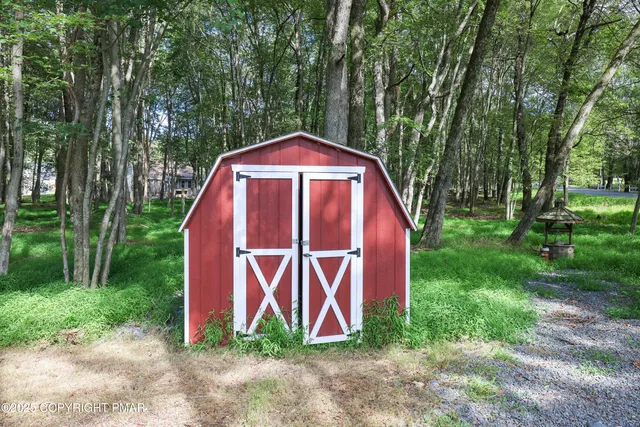 a swimming pool with trees in the background