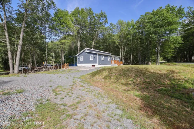 a house with trees in the background