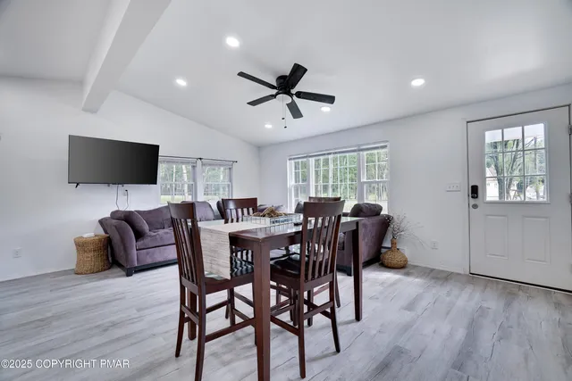 a view of a livingroom with furniture window and wooden floor