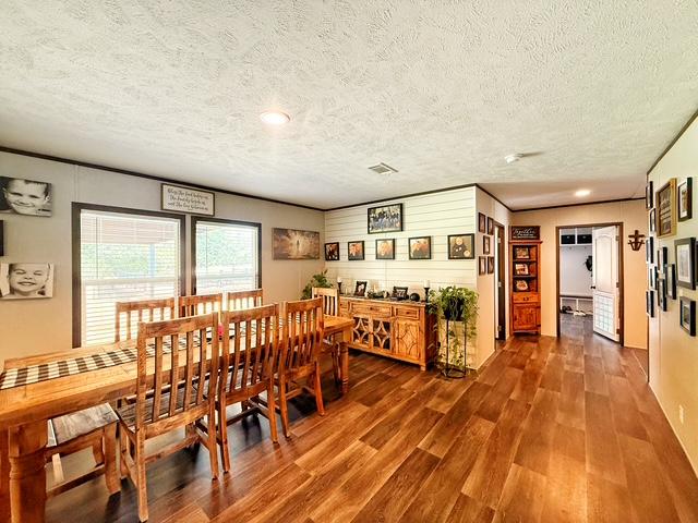 36469 1330th Road Wewoka, OK 74884 - Photo 31 of 39 Wood-finish flooring throughout, featuring a dining area with ample natural light from two windows