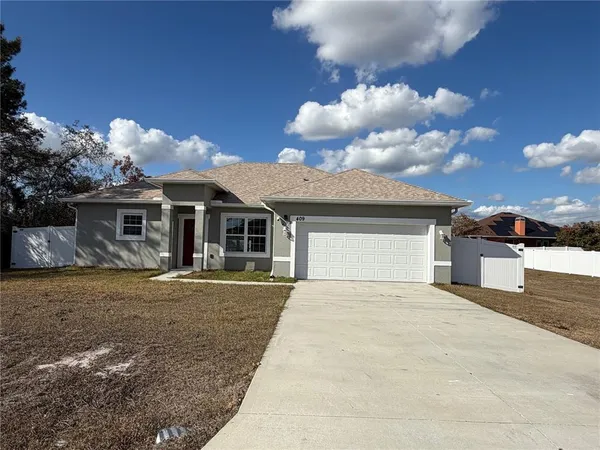 a front view of a house with yard