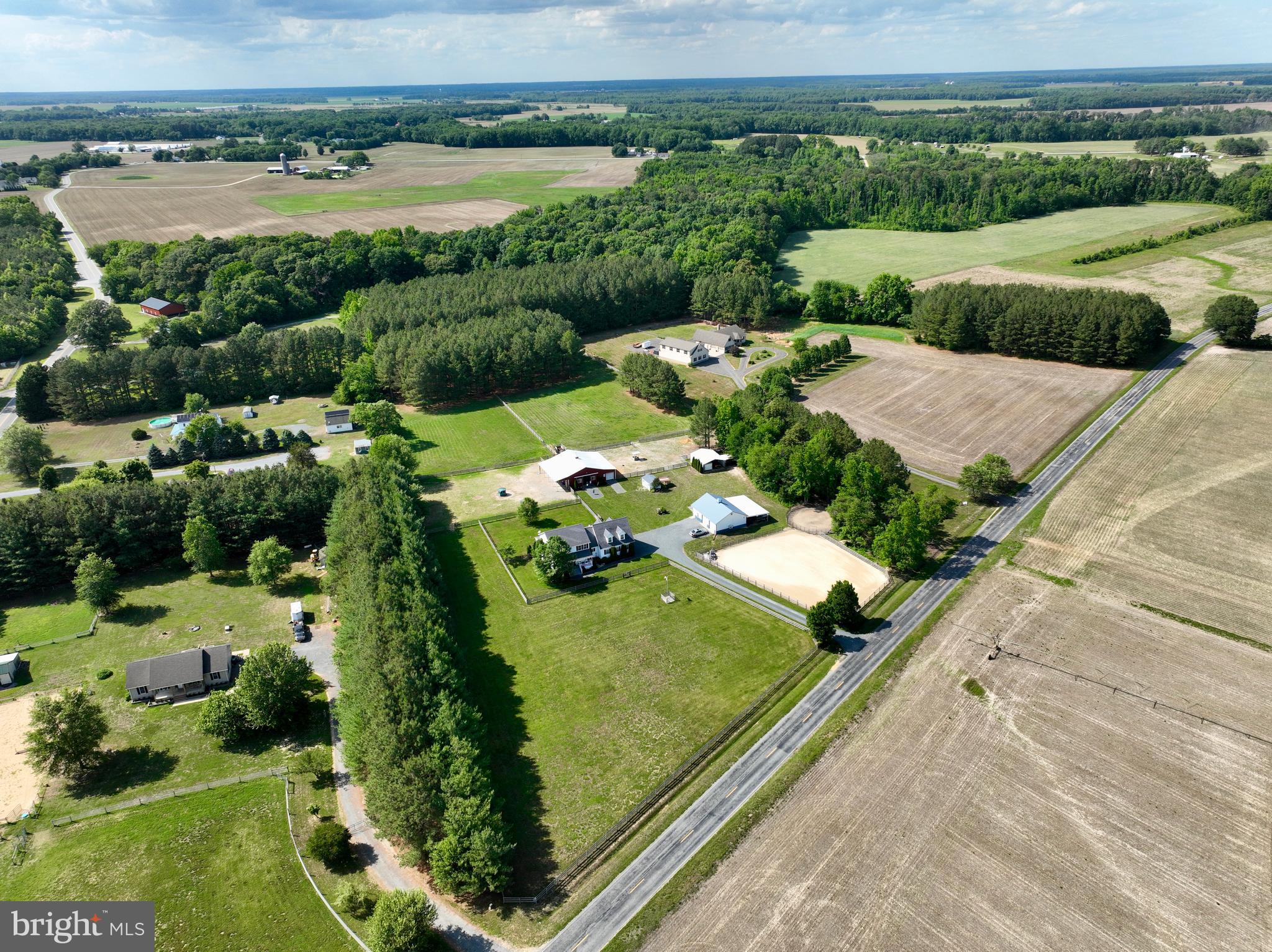 12136 Holly Road Ridgely, MD 21660 - Photo 1 of 136 an aerial view of a house with a yard and lake view