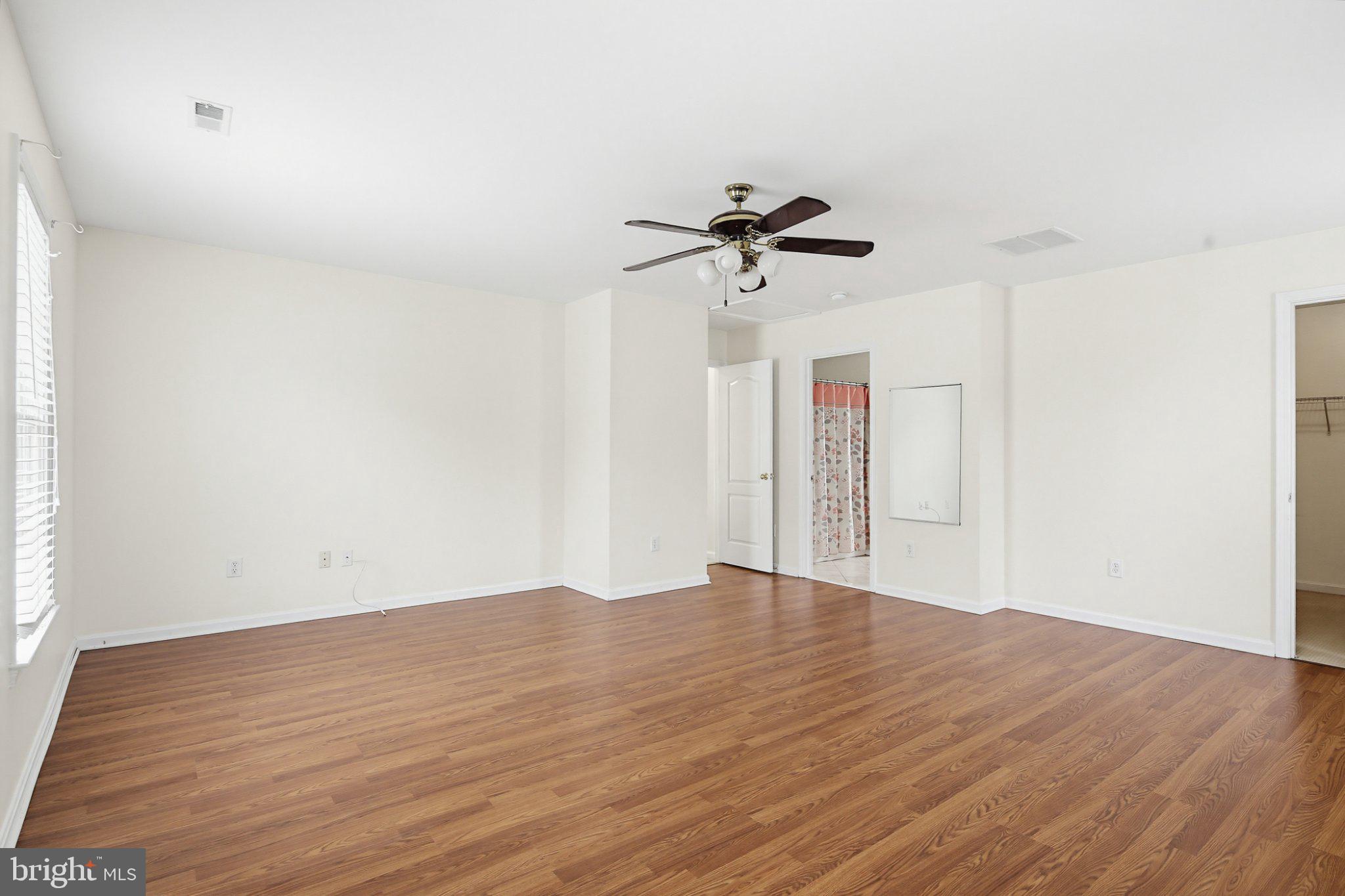 3641 Branhum Road Edgewater, MD 21037 - Photo 30 of 63 a view of room with wooden floor and ceiling fan