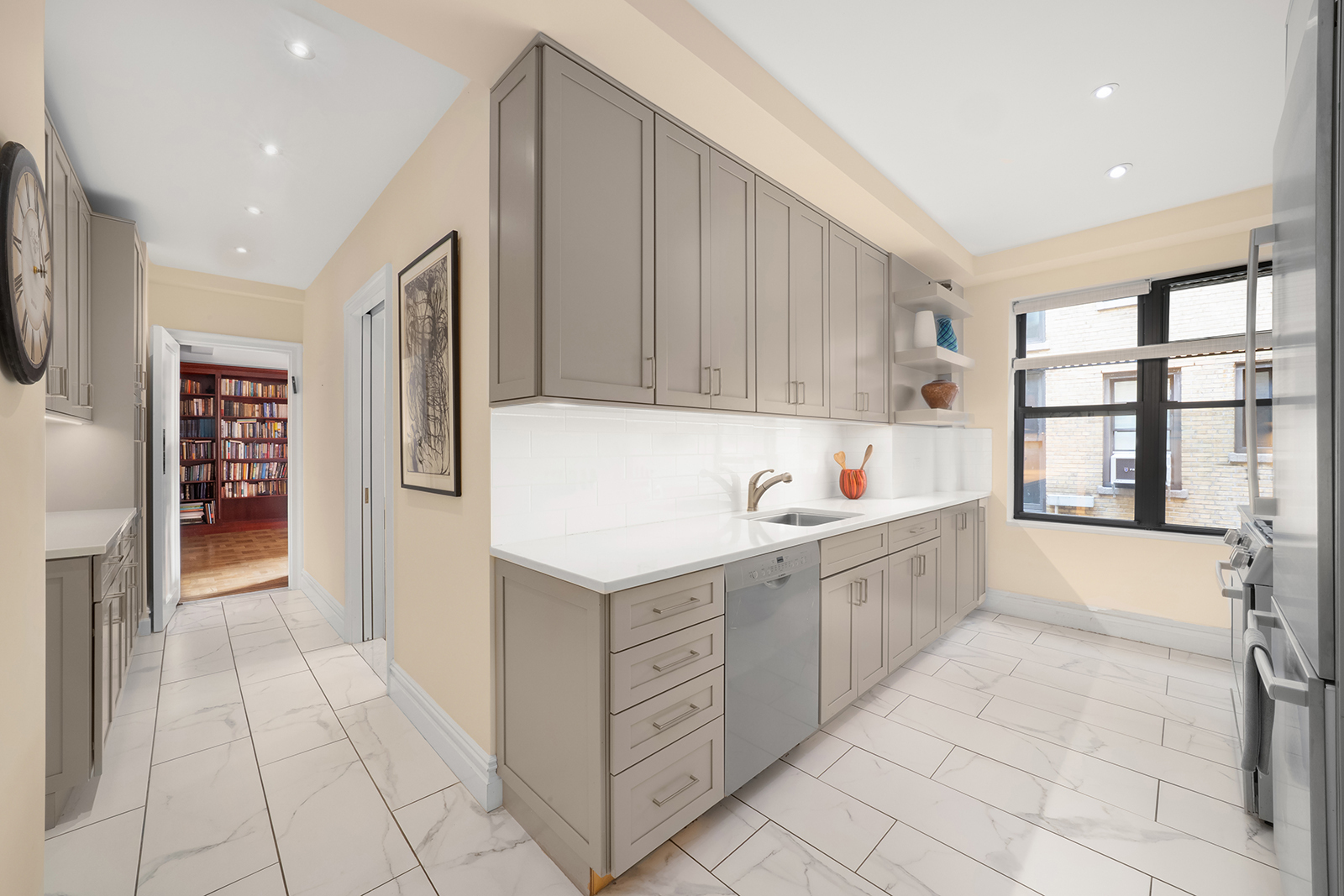 277 West End Avenue, Unit 12MA Manhattan, NY 10023 - Photo 4 of 12 a kitchen with a cabinets and window