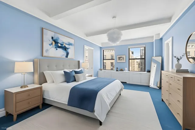 a spacious bedroom with a large bed and a window