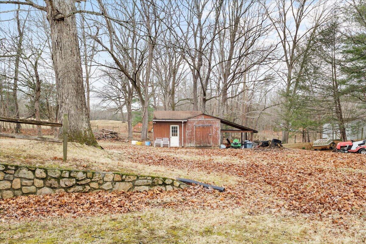 1297 Flowing Spring Road Buchanan, VA 24066 - Photo 39 of 42 a large house with a large tree in front of it