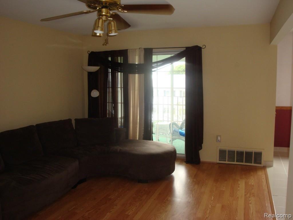 430 Baldwin Avenue, Unit 75 Rochester, MI 48307 - Photo 9 of 17 Living room with Doorwall to balcony