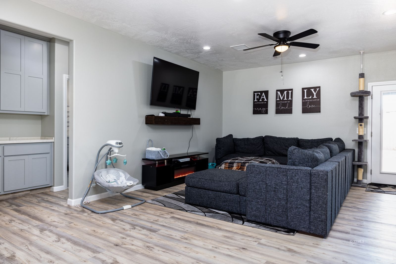 915 West Perch Avenue Ridgecrest, CA 93555 - Photo 18 of 41 a living room with furniture and a flat screen tv