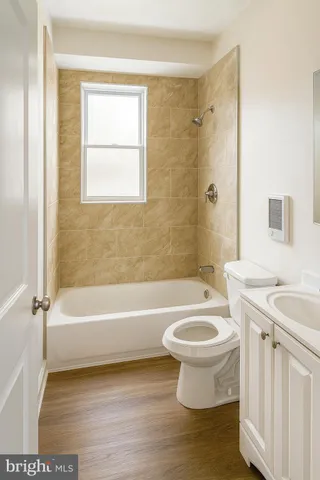 a bathroom with a sink a toilet and a bathtub