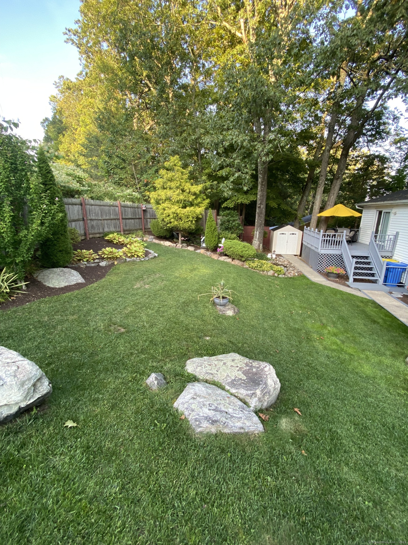 110 Wooster Avenue Waterbury, CT 06708 - Photo 17 of 35 a backyard of a house with table and chairs
