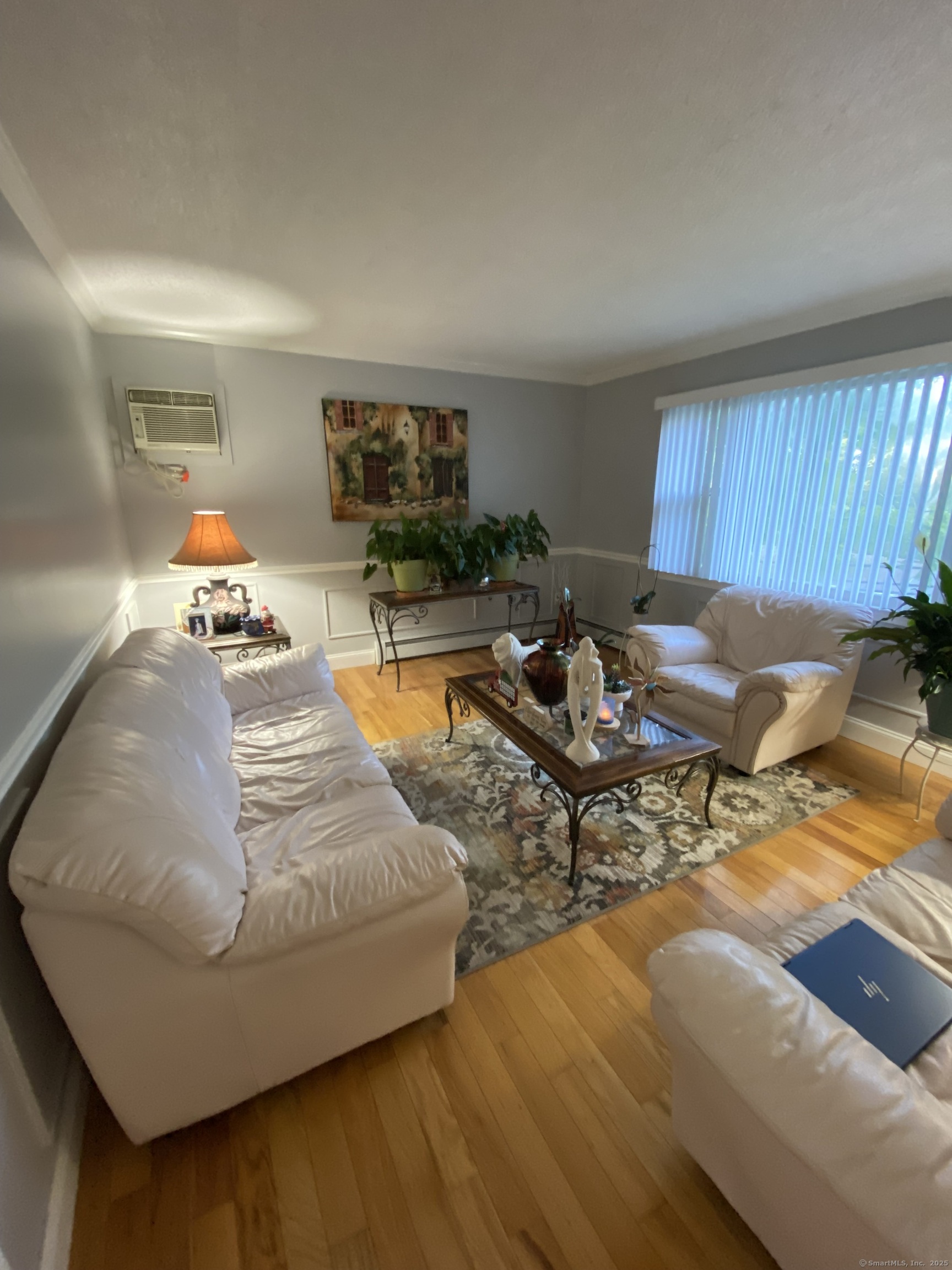 110 Wooster Avenue Waterbury, CT 06708 - Photo 24 of 35 a living room with furniture and a wooden floor