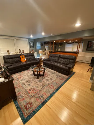 a living room with furniture and a rug