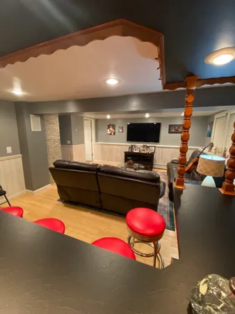 a kitchen with stainless steel appliances kitchen island granite countertop a stove and cabinets