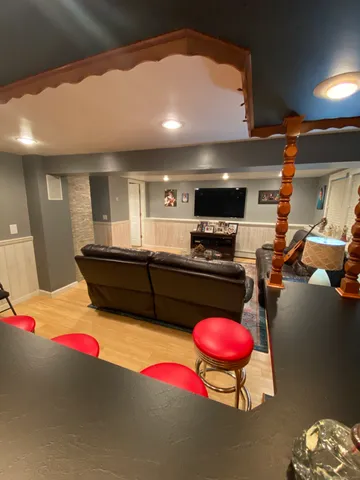 a kitchen with stainless steel appliances kitchen island granite countertop a stove and cabinets