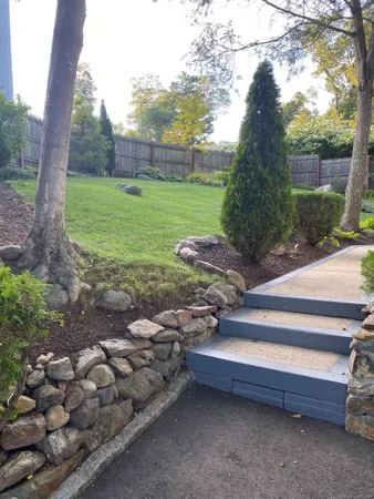 a backyard of a house with lots of green space