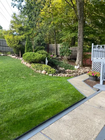 a view of a backyard with sitting area