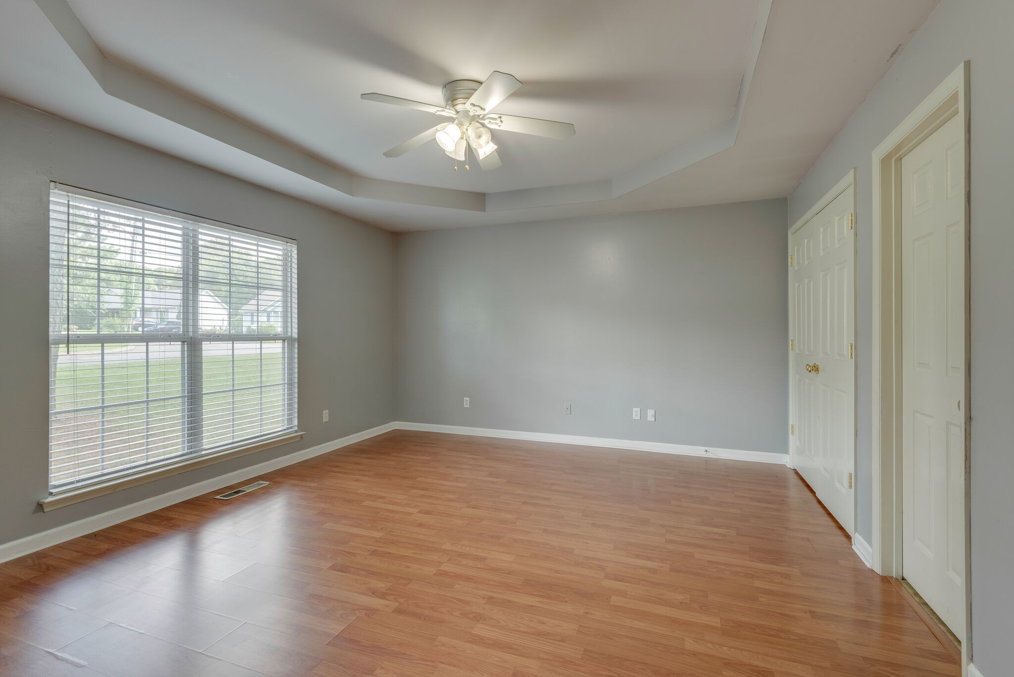 7325 Matthew Street Fairview, TN 37062 - Photo 12 of 27 a view of an empty room with wooden floor and a window