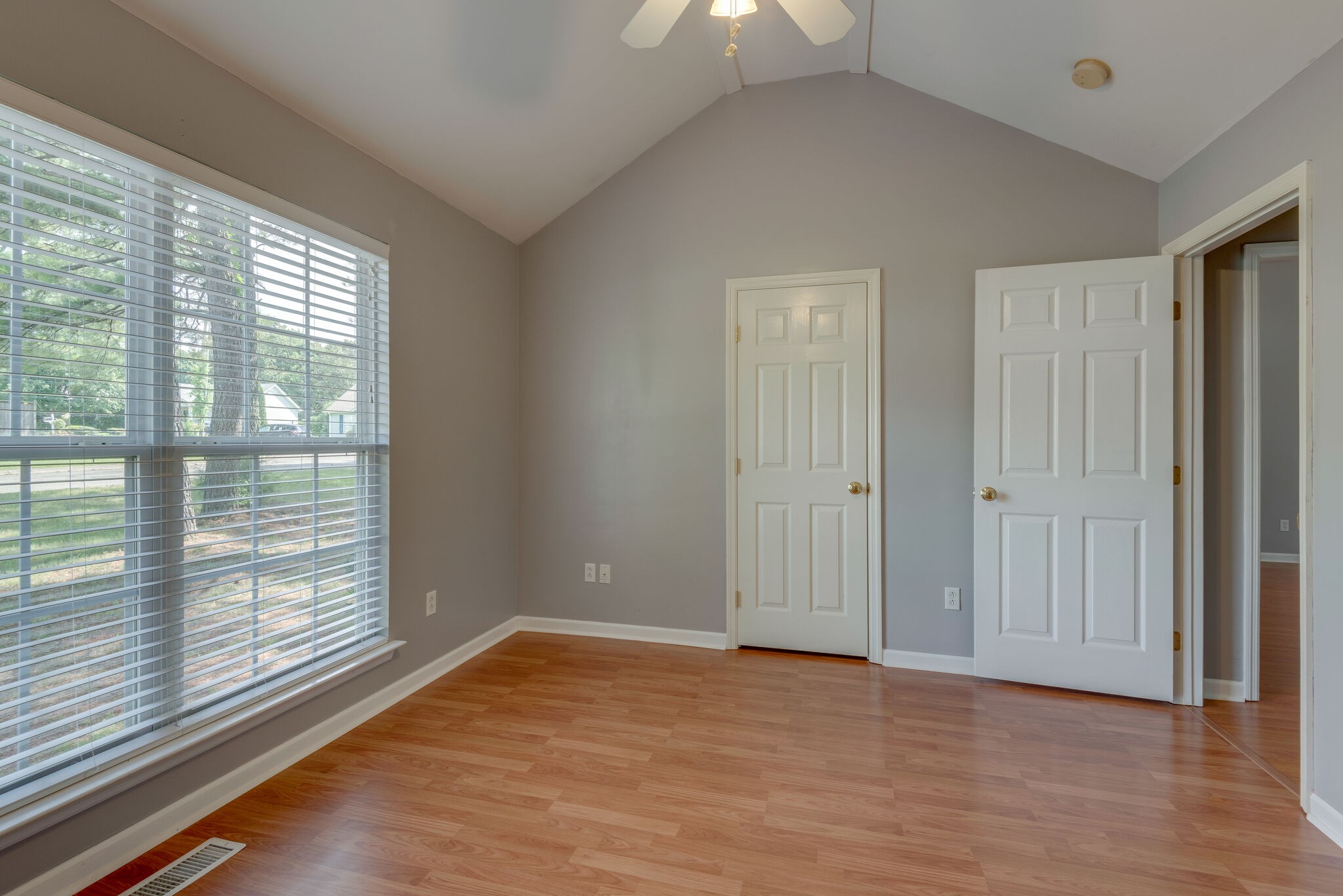 7325 Matthew Street Fairview, TN 37062 - Photo 17 of 27 a view of an empty room with wooden floor and a window