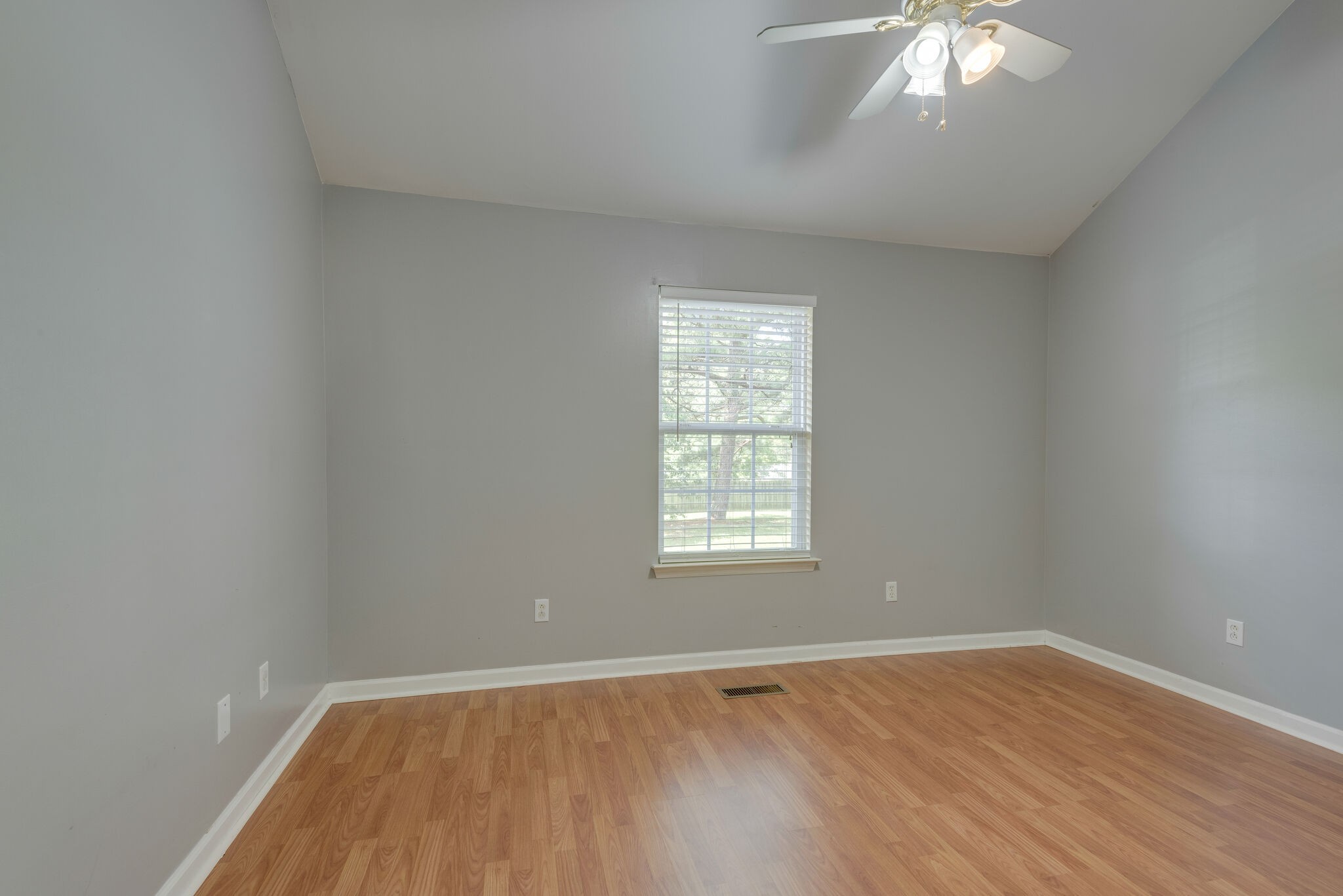 7325 Matthew Street Fairview, TN 37062 - Photo 20 of 27 an empty room with wooden floor and windows