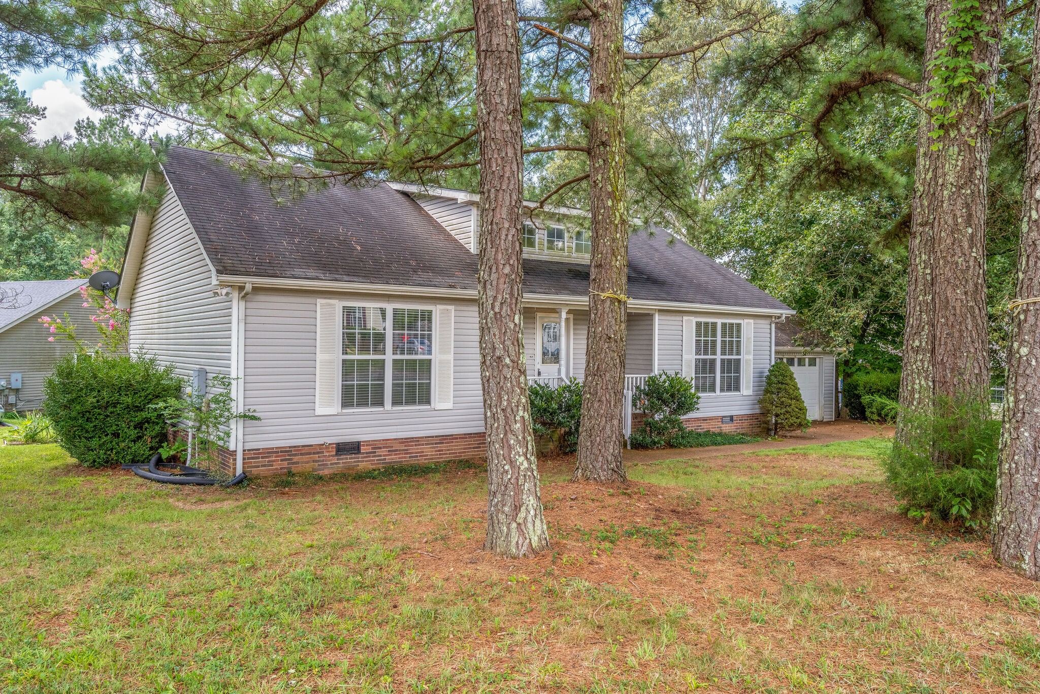 7325 Matthew Street Fairview, TN 37062 - Photo 23 of 27 a view of a house with a yard and large tree