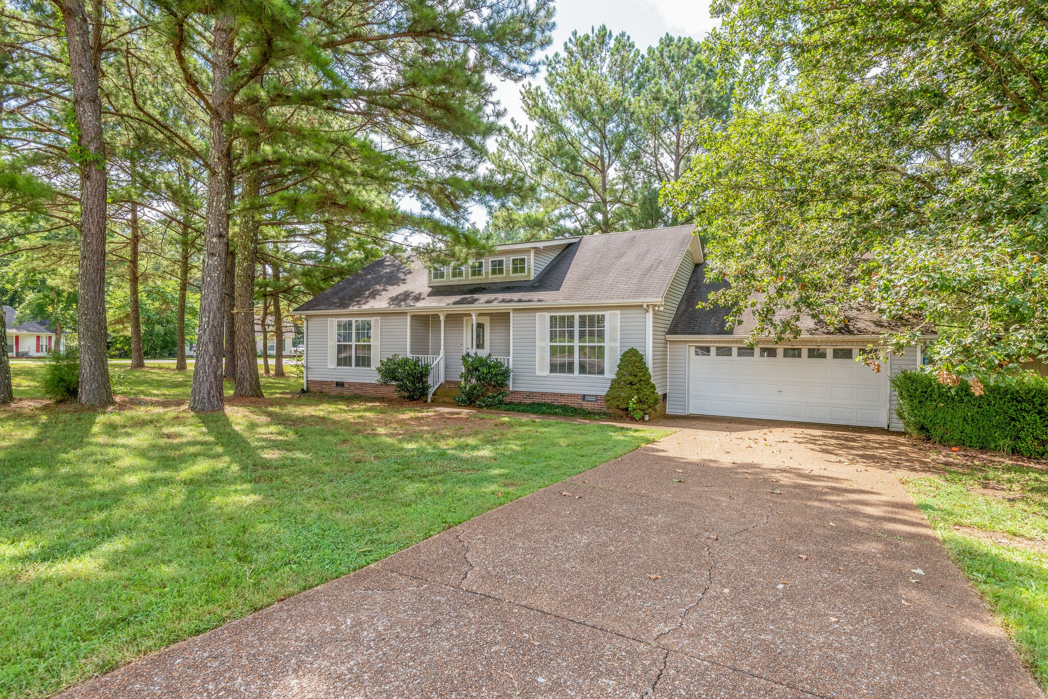 7325 Matthew Street Fairview, TN 37062 - Photo 24 of 27 a front view of a house with a yard and garage