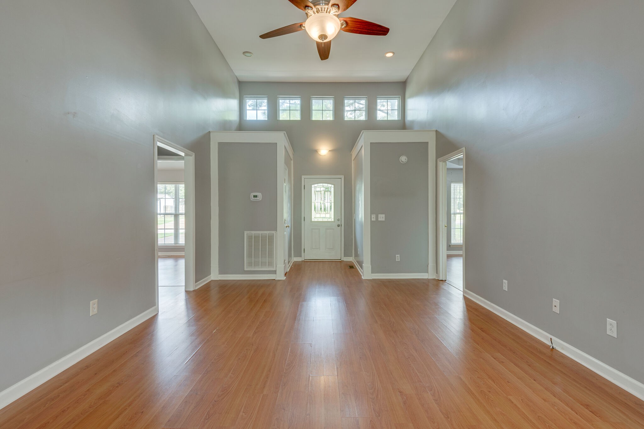 7325 Matthew Street Fairview, TN 37062 - Photo 3 of 27 wooden floor in an empty room with a mirror