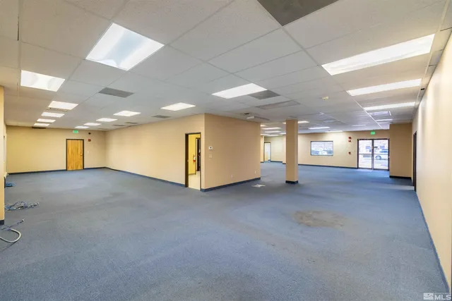 a view of a hallway with a window