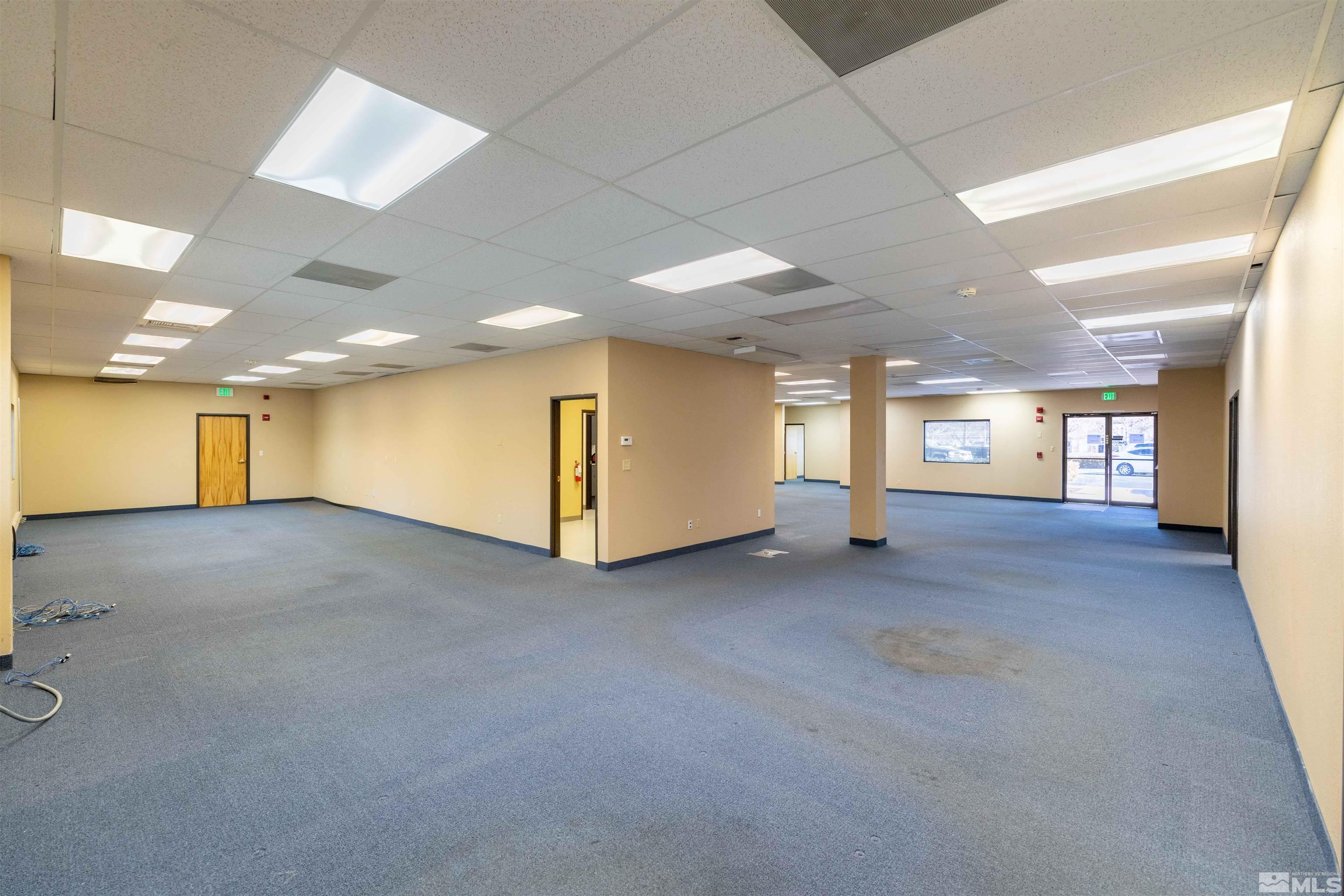 a view of a hallway with a window