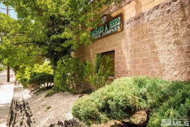 a signage on a brick wall