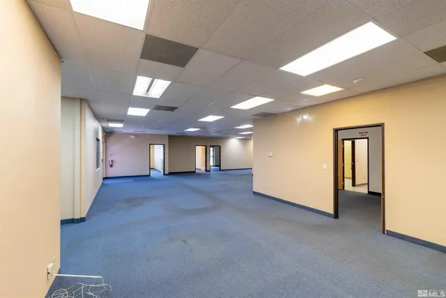 a view of a hallway with a room